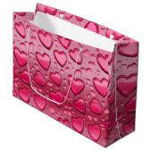 Hübsche rosa, herzenförmige Wassertropfen - Gesche Große Geschenktüte (Vorderseite Schrägansicht)