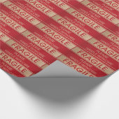 Hübscher Griff mit Sorgfalt, zerbrechliches Zeiche Geschenkpapier (Ecke)