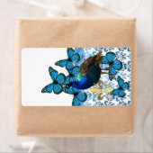 Hübscher Pfau und blaue Schmetterlinge (Insitu)