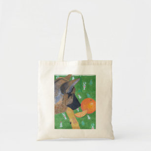 Hund und orangefarbene Tasche