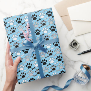 Hundepfotenabdrücke und Knochen Muster Blau Geschenkpapier