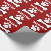 Hundetatzen-und -knochen-ROTER individueller Name Geschenkpapier (Ecke)