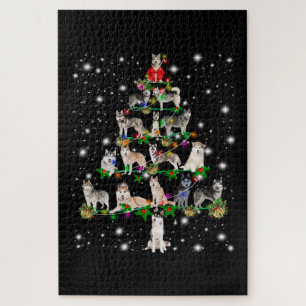 Husky Weihnachtsbaum mit leuchtendem Licht bedeckt Puzzle