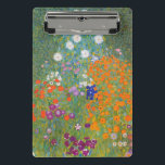 Hütte Gustav Klimt Blumengarten Mini Klemmbrett<br><div class="desc">Ein wunderschönes Gartenbild - das ist ein klassisches Gemälde von Gustav Klimt,  genannt Hütte Garden,  oder Bauergarten,  1907,  das ein nahes Bild eines Blumengartens,  ein buntes Blumengemälde ist.</div>