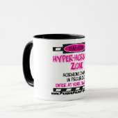 HYPER-HORMONE Zonen-warnende Tasse (Vorderseite Links)