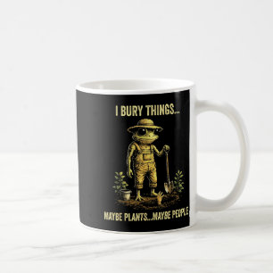 Ich begrabe Dinge, vielleicht Pflanzen, vielleicht Kaffeetasse