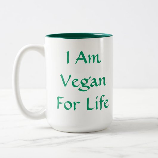 Ich bin für das Leben vegan. Grün. Slogan. Zweifarbige Tasse (Links)