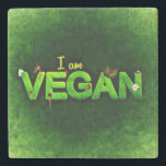 Ich bin Vegan mit einer grasbewachsenen Naturstruk Steinuntersetzer<br><div class="desc">Ich bin vegan in hellgrün auf einer dunkelgrünen Leinwand wie Hintergrund geschrieben. Das Wort vegan ist mit einer grünen grasähnlichen Textur geschrieben. Kleine naturbezogene Ladybugs,  Gänseblümchen und Blätter schmücken die Worte.</div>