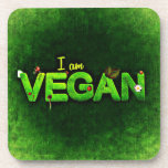 Ich bin Vegan mit einer grasbewachsenen Naturstruk Untersetzer<br><div class="desc">Ich bin vegan in hellgrün auf einer dunkelgrünen Leinwand wie Hintergrund geschrieben. Das Wort vegan ist mit einer grünen grasähnlichen Textur geschrieben. Kleine naturbezogene Ladybugs,  Gänseblümchen und Blätter schmücken die Worte.</div>