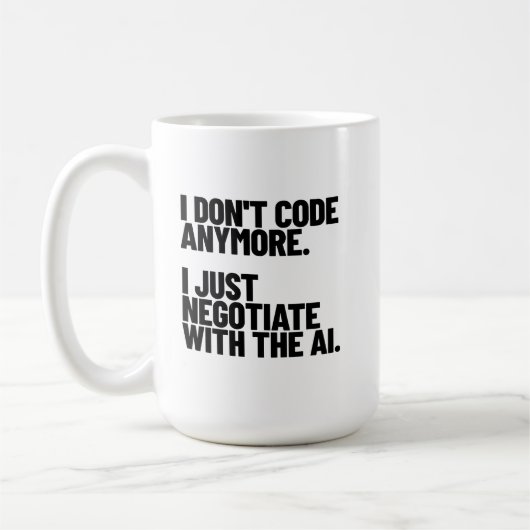Ich code nicht mehr, ich verhandle mit der KI Kaffeetasse (Links)