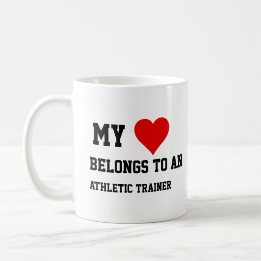 Ich gehöre zu einem Sporttrainer Kaffeetasse (Links)