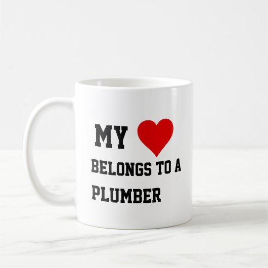 Ich gehöre zu einer Klempner-Tasse Kaffeetasse (Links)