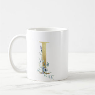 Ich golden anfänglich mit blauem Blumenblättern Kaffeetasse