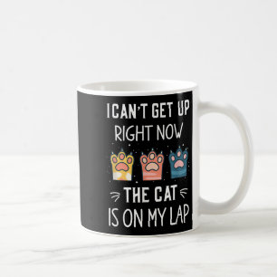Ich kann jetzt nicht aufstehen, die Katze sitzt au Kaffeetasse