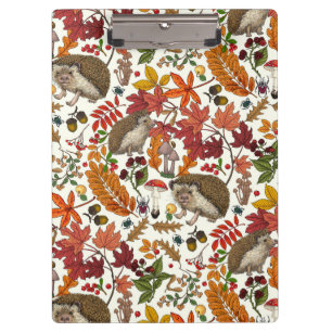 Igel und Herbstwaldflora auf Elfenbein Klemmbrett