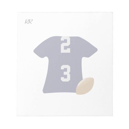 Ihr Fußball-Shirt mit Ball auf kleinem Notizblock
