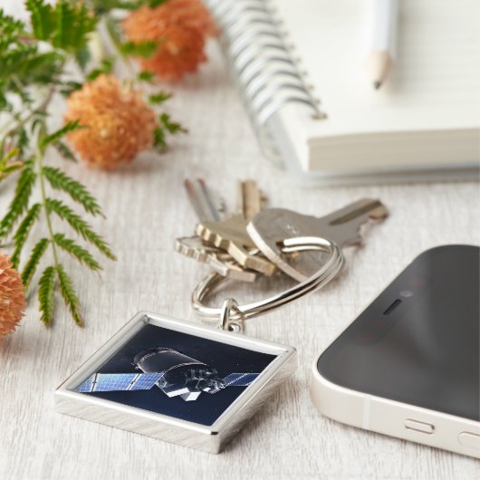 Illustration der Dragon XL-Raumsonde. Schlüsselanhänger (Seite)