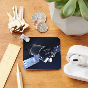 Illustration der Dragon XL-Raumsonde. Schlüsselanhänger