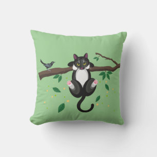 Illustration einer schwarzen und weißen Katze auf  Kissen