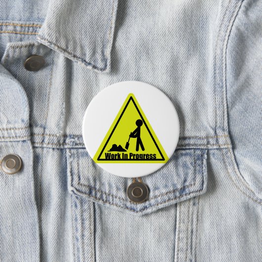 Im Entstehen befindliches Werk-Knopf Button (Beispiel)