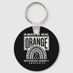 Im März tragen wir eine orange Entwicklungsbehinde Schlüsselanhänger