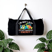 I'M NOT LAZY, I'M JUST CONSERVING ENERGY DUFFLE BAG