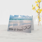 Im Sand geschriebene Bräunungsnamen Karte (Gelbe Blume)