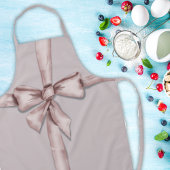 In einem rosa Bogen gefangen Schürze