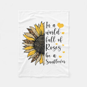 In einer Welt voller Rosen sei eine Sonnenblume Le Fleecedecke