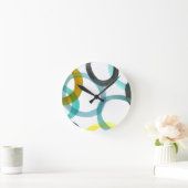 Ineinander greifen der gelben u. blauen Kreise Runde Wanduhr (Zuhause)