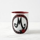 Initial Lady M Tasse (Zentrum)