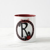 Initial Lady M Tasse (Zentrum)