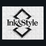 Ink&Style Puzzle<br><div class="desc">¡Sé el primero en tenerlo! Presentamos la primera obra oficial de Ink&Style: un diseño único que combina elegancia, trazos artísticos y geometría con carácter. Esta pieza es más que un logo: es una declaración de estilo, creatividad e identidad visual. Ideal para cuadros decorativos, rompecabezas, bolsos, posters o cualquier objeto con...</div>