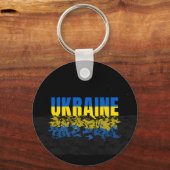 Inschrift Ukraine in blau-gelb Farbe. Ukraine Schlüsselanhänger (Vorderseite)