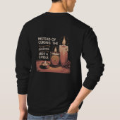 Instead of cursing the darkness, light a candle. T-Shirt (Rückseite)