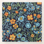 Intricate Floral Art: Blue and Orange Flowers  Glasuntersetzer<br><div class="desc">Vibrant floral pattern with blue and orange flowers and green leaves on a dark background. Intricate,  lively design with an elegant,  artistic feel.</div>