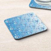 Intrikierte blaue und weiße Sterne und Schneeflock Getränkeuntersetzer (Linke Seite)