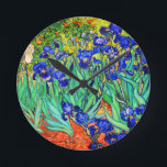 Irises von Vincent Van Gogh Runde Wanduhr<br><div class="desc">Vincent Van Gogh Irises 1889 gemalt ist es eines der Gemälde,  die er in Saint Paul-de-Mausole Asyl in Saint-Rémy-de-Provence in Frankreich erschuf. Es ist ein Ölgemälde. Diese kunstvolle Ölmalerei zeigt ein Feld von Iris-Blume-Pflanze.  Vincent Van Gogh war ein berühmter Künstler. Er war ein niederländischer Postimpressionist.
Dieses Gemälde ist öffentlich.</div>