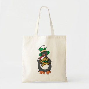 Irish Penguin hält Weihnachts-Teddybär Tragetasche