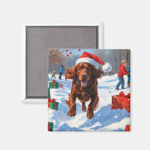 Irish Red Setter läuft durch Schnee mit Weihnachts Magnet