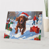 Irish Red Setter Running Snow mit Weihnachtshut Karte (Vorderseite)