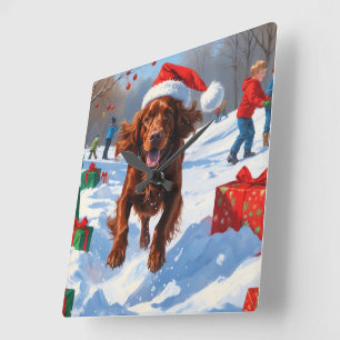Irish Red Setter Running Snow mit Weihnachtshut Quadratische Wanduhr