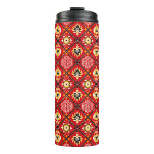 Italienische Kachel. Stickerei mit Blume und Thermosbecher