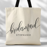 Ivory Cream Bridesmaid Modernes Skript Tasche<br><div class="desc">Zeigen Sie Ihrem Brautparty mit dieser stilvollen Elfenbein-Totentasche Ihre Wertschätzung. Diese Tasche mit modernem Drehbuch und dem Namen Ihrer Brautjungfrau ist praktisch und elegant zugleich. Die weiche Farbe und das schicke Design machen es perfekt, um das Wesentliche des Hochzeitstages oder Alltagsgegenstände zu tragen. Diese personalisierte Totttasche verleiht den Brautmädchen eine...</div>