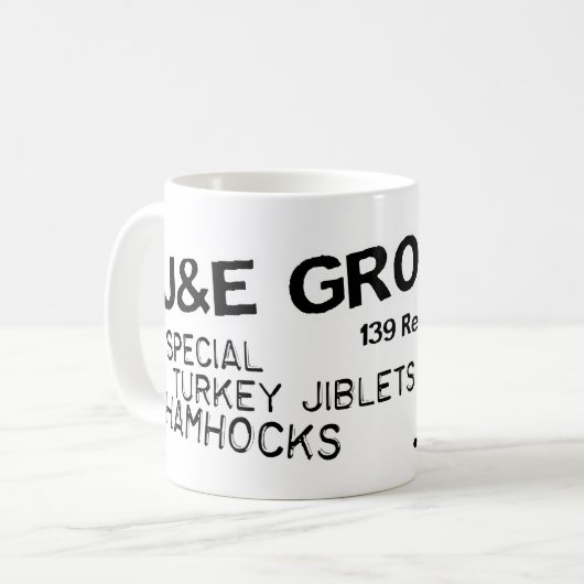 J- u. e-Lebensmittelgeschäft-Tasse Kaffeetasse (Vorderseite Links)