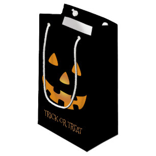 Jack o Laternengesicht auf schwarzem Hintergrund Kleine Geschenktüte