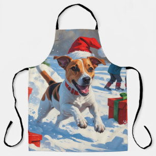 Jack Russell läuft im Schnee mit Weihnachtsmütze Schürze