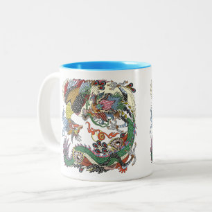 Jade Dragon und Gold Phoenix spielen mit einer Per Zweifarbige Tasse