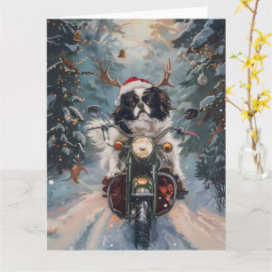Japan-Chin-Hund fährt auf Motorrad Weihnachten Karte