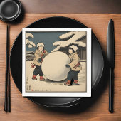Japanese children rolling large snow ball serviette